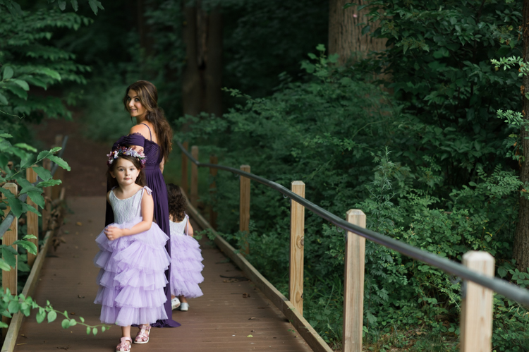 I was thrilled when Michelle from Pink Comb Studio reached out for her maternity photos. Following COVID-19 rule, keeping social distance I photographed Michelle and her two beautiful girls at Watchung Mountain NJ. With overcast weather three trees and grass showed such a rich deep green colors. I love bold rich colors in my photos as much as I love sunset golden hour. Michelle was just glowing and looked so beautiful. Was so happy to have such a beautiful mama in front of my camera before Michelle becomes mama of three girls. I can not wait to see her new baby girl and see her family grow. Michelle Surgent’s maternity session captured by Karis from heykaris.